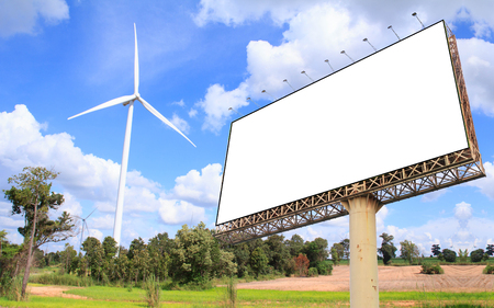 Blank billboard at wind turbine farm for advertisementの写真素材