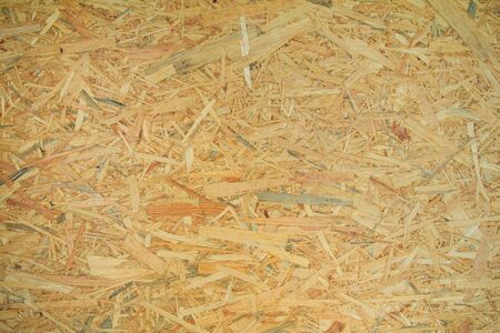 Weathered obsolete rough textured old plywood backgroundの写真素材