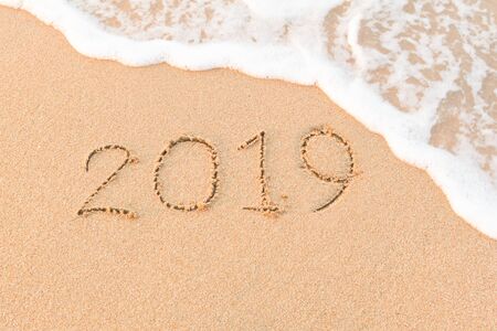 New Year 2020 is coming concept. Happy New Year 2020 replace 2019 concept on the sea beachの写真素材