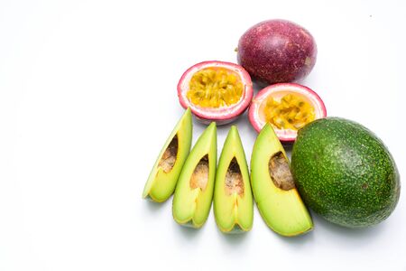 Group of avocados and passion fruit isolated on a white background