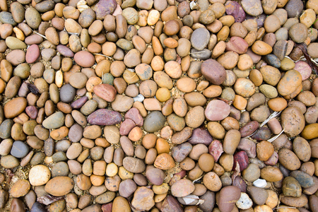Multi color rock pebbles backgroundの写真素材