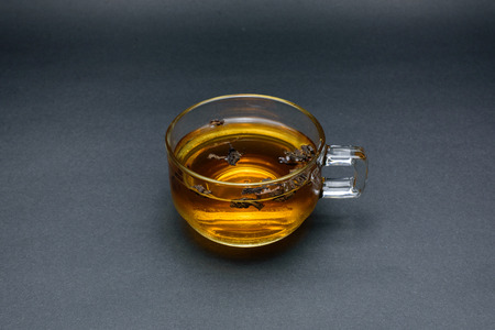 Clear glass of tea isolated on black background.の写真素材