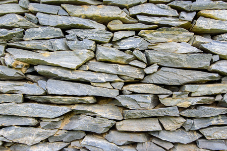Background of gray stone wall textureの写真素材
