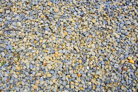 Brown and gray rock pebbles backgroundの写真素材
