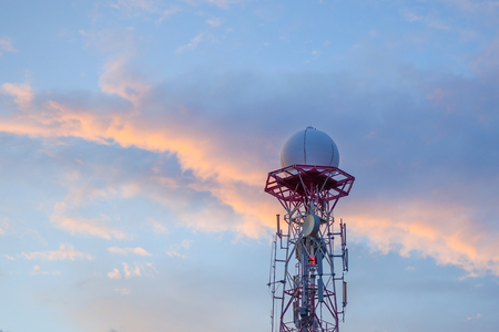 Radar dome in the sea with blue sky and clouds background.の写真素材