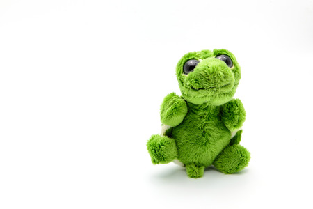 Green turtle doll with happy emotion isolated on white backgroundの写真素材