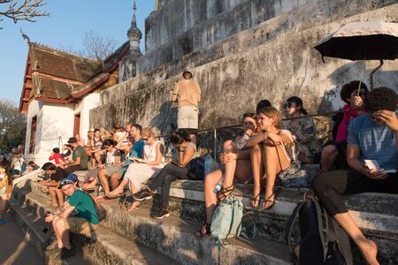 LUANG PRABANG, LAOS - February 16, 2017:Travelers waiting for watching sunset at Phu Si Temple, Luang Prabang, Laos.のeditorial素材