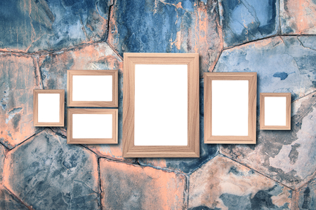 Collage of blank brown wooden frames , interior decor mock up on marble wall, vintage style.