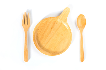 Top view of Kitchenware set of wooden dish, fork, and spoon on white background.の写真素材