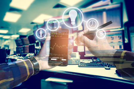 Double exposure photo, hand touching mobile phone for using business tool icons,Investment manager...