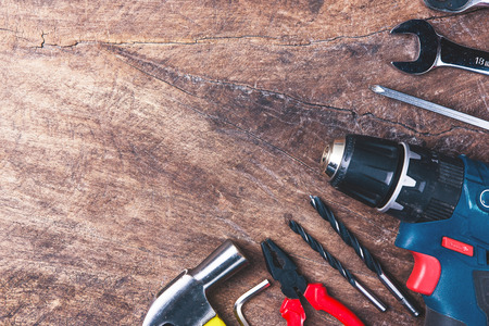 Top view of Working tools,wrench,socket wrench,hammer,screwdriver,plier,electric drill,tape...
