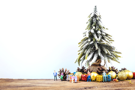 Christmas or New Year background with pine cones,gift box,golden ball and pine tree of Xmas decorations and fir branches, blank space for a greeting text on white.の写真素材