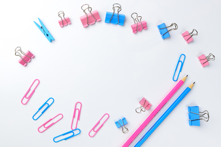 Stationary concept, Flat Lay top view Photo of Scissors, pencils, paper clips, sticky note,stapler in pink and blue tone on white background with copy space.の写真素材