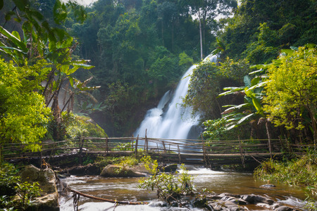 beautiful waterfall in northern Thailand, name Pha dok siew waterfall in Doi intanon national park with bamboo bridge.の写真素材