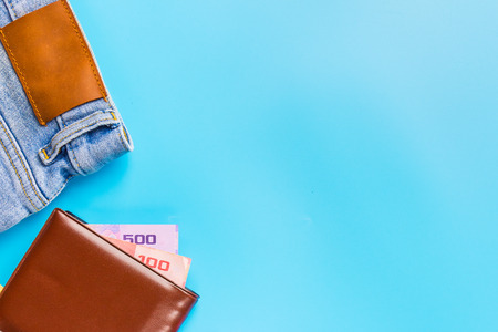 Travel accessories costumes concept for summer vacation trip. Passports, luggage, map, smartphone,sun glasses,camera, note pad, jean on blue.の写真素材