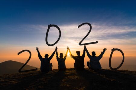 Newyear 2020 concept Silhouette of young friend jumping and hand shake for celebrate new year party.