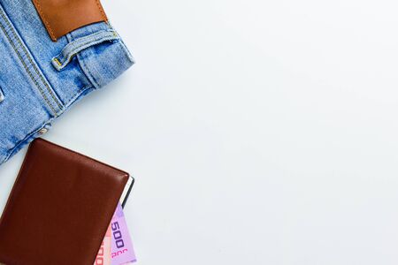 Travel accessories costumes concept for summer vacation trip. Passports, luggage, map, smartphone,sun glasses,camera, note pad, jean on white.の写真素材