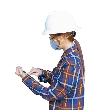 Protection against contagious disease, coronavirus. Asian Engineer woman or worker wearing hygienic mask N95 to prevent infection,airborne respiratory illness as flu,2019-nCoV,used tablet isolated.の写真素材
