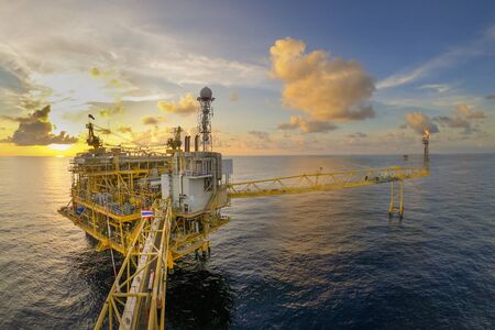 Offshore oil and gas or rig platform with beautiful sky in the evening time for oil and gas business concept.の写真素材