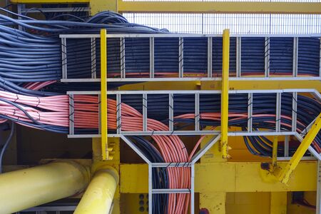 Power cables and instrument cables in the trays with piping construction for duty industry concept.の写真素材