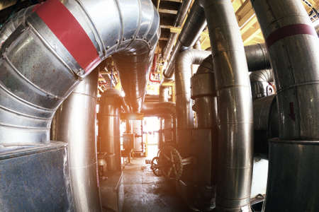 oil & gas processing piping plant as show inside of a modern industrial power plant for business...
