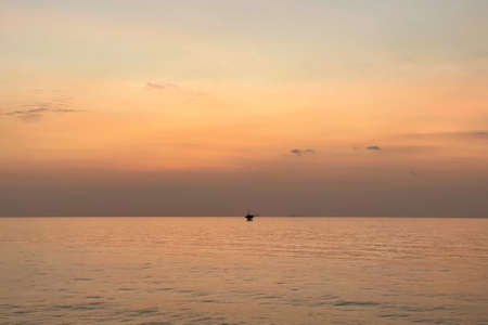 Close up of sun flower against a blue sky on vintage warm tone.の写真素材