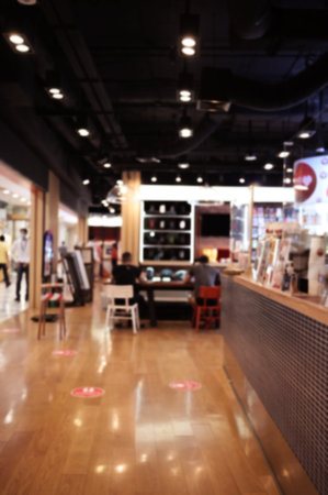 Blurred cafe background ,Coffee shop blur background with bokeh warm tone.の写真素材