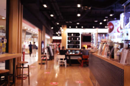 Blurred cafe background ,Coffee shop blur background with bokeh warm tone.の写真素材