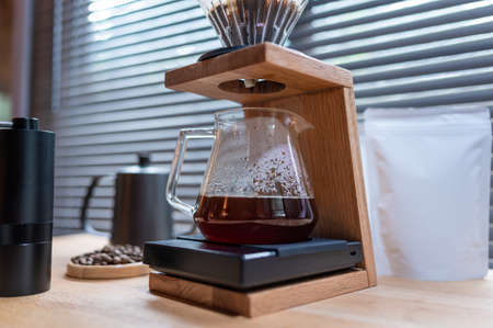 Hand drip coffee, Barista making drip coffee with mockup blank package coffee Alternative ways of brewing Coffee shop concept.の写真素材