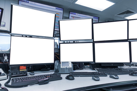 group of blank monitors and screen on security desk or control room for monitor process or stock data trading.の写真素材