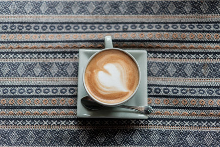 Cup of coffee with heart sign latte art on top viewの写真素材