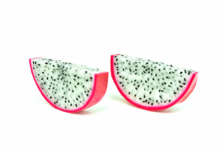 Dragon fruit. Pink peel fruit. Sweet taste. Sliced. Isolated. On a white backgroundの写真素材