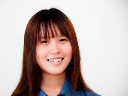 asian teenager smiling on white backgroundの写真素材