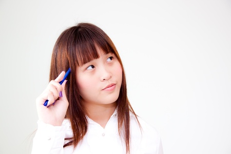 cute asian woman thinkingの写真素材
