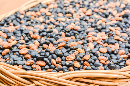 Different of two color bean in a basketの写真素材