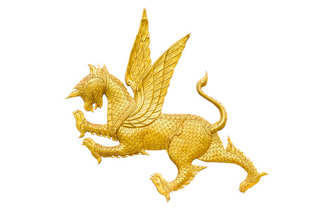 Golden Lion statue with wings, Asian style art, isolated on a white backgroundの写真素材