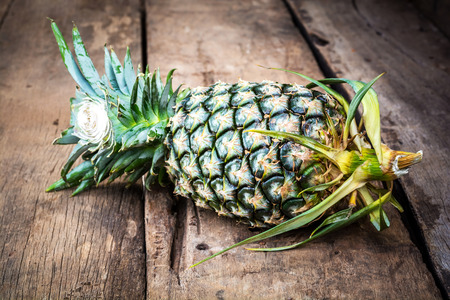 pineapple on old woodenの写真素材