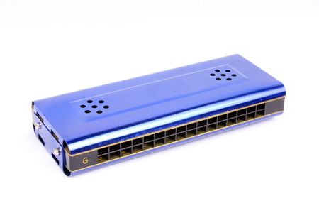 A blue harmonica in G musical scale, on a white background.