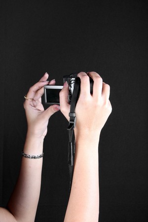 A digital camera in some females hands.の写真素材