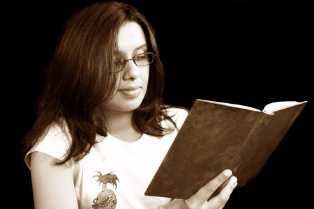 A beautiful Indian girl reading a book.の写真素材