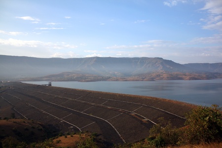 The structure of a dam in India, under blue skies.の写真素材