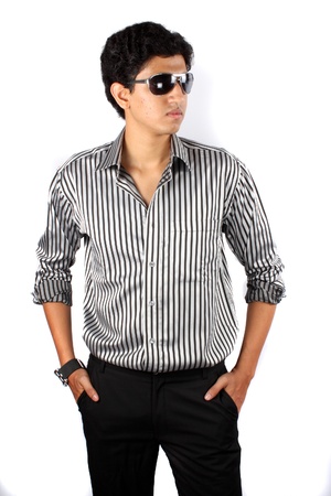 A portrait of a smart Indian guy in stylish attire.の写真素材