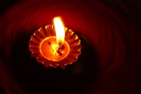 A background of a traditional Diwali lamp with a rotating design.の写真素材