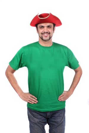 A young Indian guy wearing a red ship captain hat, on white studio background.の写真素材