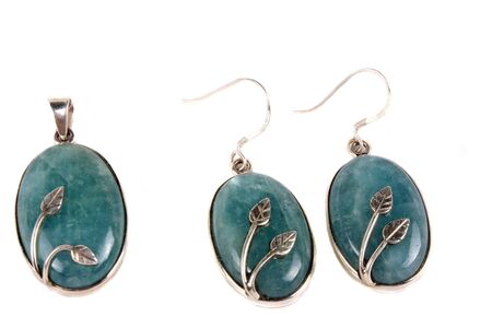 A jewelery set made of aquamarine gemstones used for calming a persons anxieties, isolated on white studio background.の写真素材