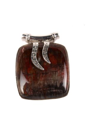 A Jasper pendant made of silver used as jewelery or alternate therapy method in crystal healing on astrology, isolated on white studio background の写真素材