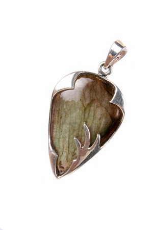A labradorite pendant made of silver used as jewelery or in alternative therapies like crystal healing and astrology, isolated on white studio background の写真素材