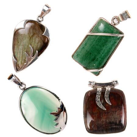 A set of silver pendants having green jade, green onyx, jasper and labradorite stones  Used as...