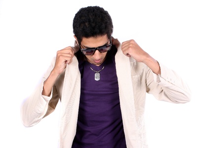 A stylish young Indian guy wearing a jacket, on white studio background の写真素材