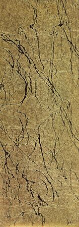 A background of the surface of a handmade paper in cracked golden design used by ancient royals in India の写真素材